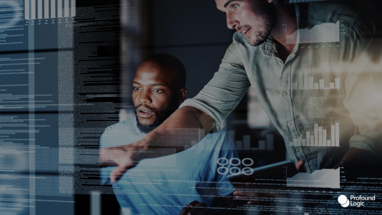 Two men working at a computer