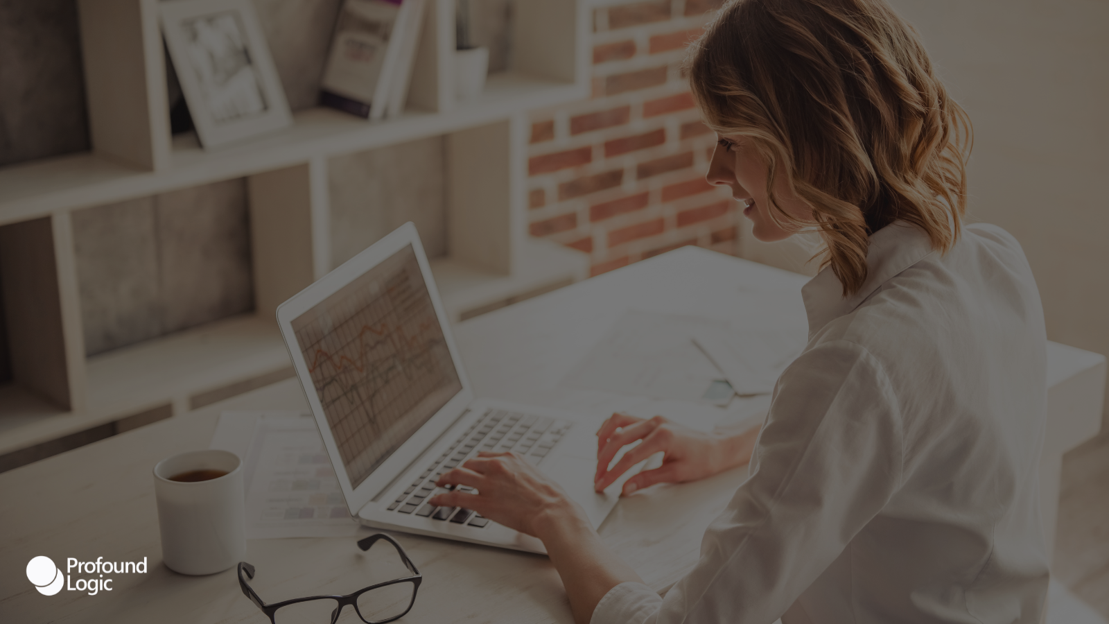 a person working on their laptop at a desk