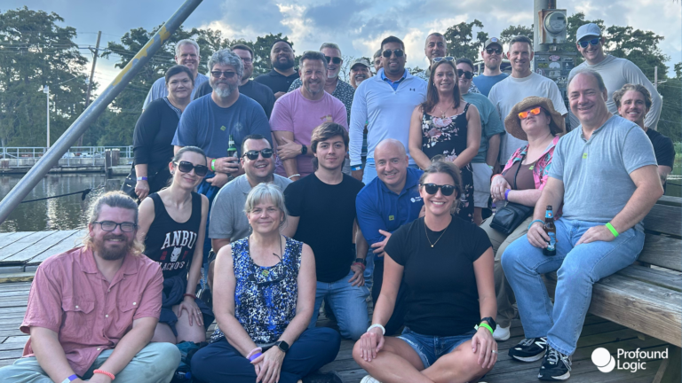 The Profound Logic Sales, Marketing and Transformation teams sit on the dock about to board their Swamp Tour in Louisiana.